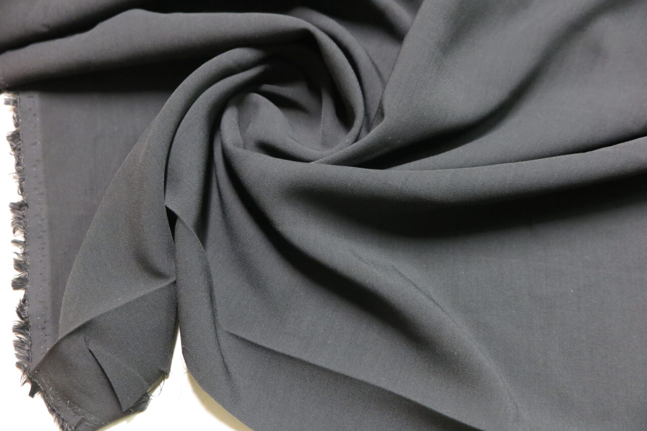 Sponge Rayon Woven Fabric with Stretch in Black • Promenade Fine Fabrics